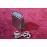 A hallmarked silver matchbox holder and silver & marcasite brooch