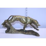 A heavy brass figure of a hunting dog w30cm