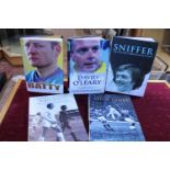 Five books related to Leeds United three of which have been signed by individual players