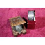 A hallmarked silver napkin ring and a hand carved wooden box