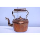 A vintage copper and brass kettle