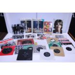 A good selection of assorted Beatles ephemera including singles