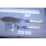 A pair of hallmarked silver mounted fish slice and fork with MOP handles