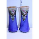 A pair of Royal Doulton vases with tube line decoration by Maude Bowden circa 1925