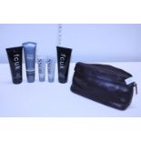 A new leather wash bag and contents of men's shaving balms etc, including Boss and FCUK