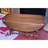 A vintage mid-century Ercol drop leaf coffee table. Shipping unavailable