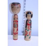 Two wooden Japanese dolls