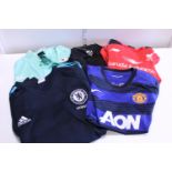 A selection of assorted sports shirts some new