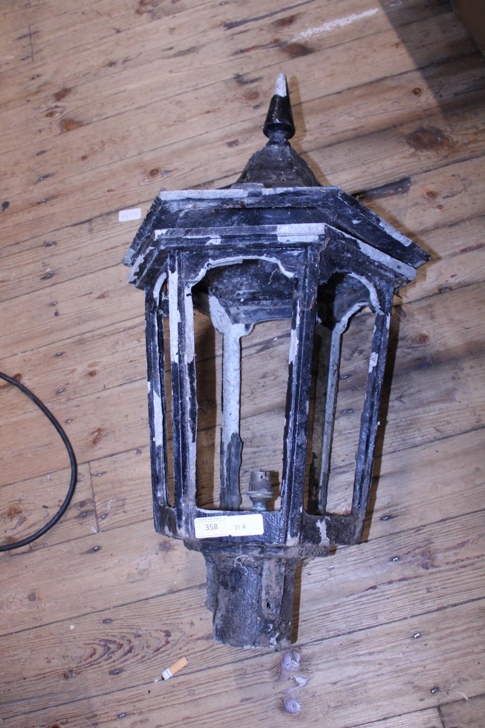 A vintage cast iron lamp post head. Shipping unavailable