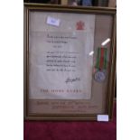 A cased defence medal belonging to a Home Guard veteran with certificate