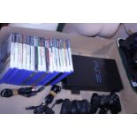 A working PS2 and controllers with assortment of games