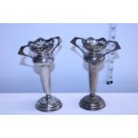 A pair of hallmarked for Chester silver posy vases