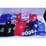 A box full of assorted sports shirts