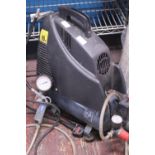 A portable tyre compressor (unchecked). Shipping unavailable