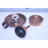 A selection of antique copperware items including a Arts & Crafts period chamber stick