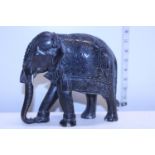 A solid carved wooden elephant
