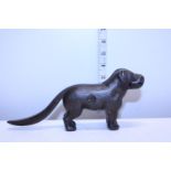 A antique brass novelty nutcracker in the form of a dog