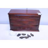 A small mahogany gradated three drawer cabinet, needs handles reattaching, shipping unavailable