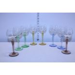 A selection of eight coloured stem and etched vintage glasses