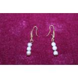 A 18ct gold and seed pearl earring set 2.51g