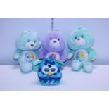 Three vintage Care Bears and a Furby