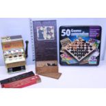 A selection assorted vintage games including a small one arm bandit
