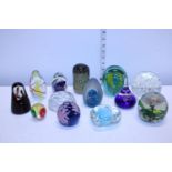 A selection of vintage paperweights including Mdina
