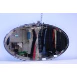 A Art Deco period chrome plated mirror with bevelled edge glass. Shipping unavailable.