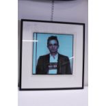 A limited edition signed print of Johnny Cash entitled 'Most Wanted' 12/495 with COA. No shipping