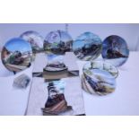 A selection of assorted collectors plates all steam train related along with cigarette cards