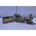 A heavy solid brass train and tender model