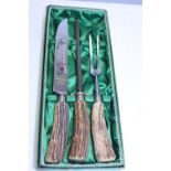 A vintage boxed bone handled meat carving set