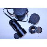 A Takumar 1:3.5 135mm camera lens and a Super Takumar 1:2/55 camera lens