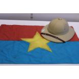 A Vietcong helmet and flag