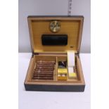 A humidor with Montecristo Cigars and others