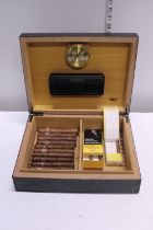 A humidor with Montecristo Cigars and others