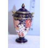 A small Royal Crown Derby lidded urn (damage to lid)