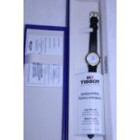 A boxed Tissot watch