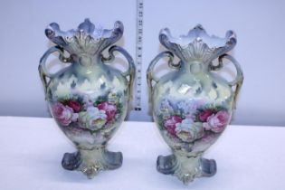 A pair of large Edwardian vases, one with repair to rim