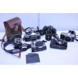 A selection of mixed camera bodies including Cannon, Pentax and Praktica (unchecked)