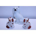 A pair of Staffordshire ceramic dogs and one other