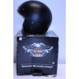A boxed new Harley Davidson motorcycle helmet. Size XL