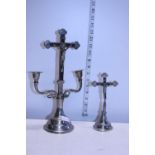 Two vintage metal crucifixes one with candle holders