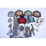 A job lot of mainly military badges and other, including Italian WW1 medal