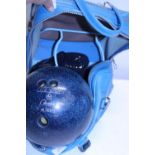 A bowling bag complete with bowling ball and shoes in bag