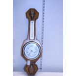 A wooden case barometer. No postage