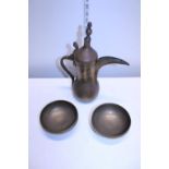 A Middle Eastern Coffee pot and a pair of heavy brass bowls