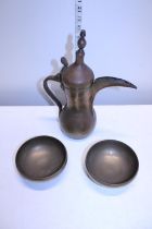 A Middle Eastern Coffee pot and a pair of heavy brass bowls