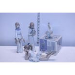 Four collectable ceramics including Nao and Lladro etc.