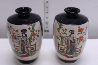 A pair of Japanese vases signed to the base